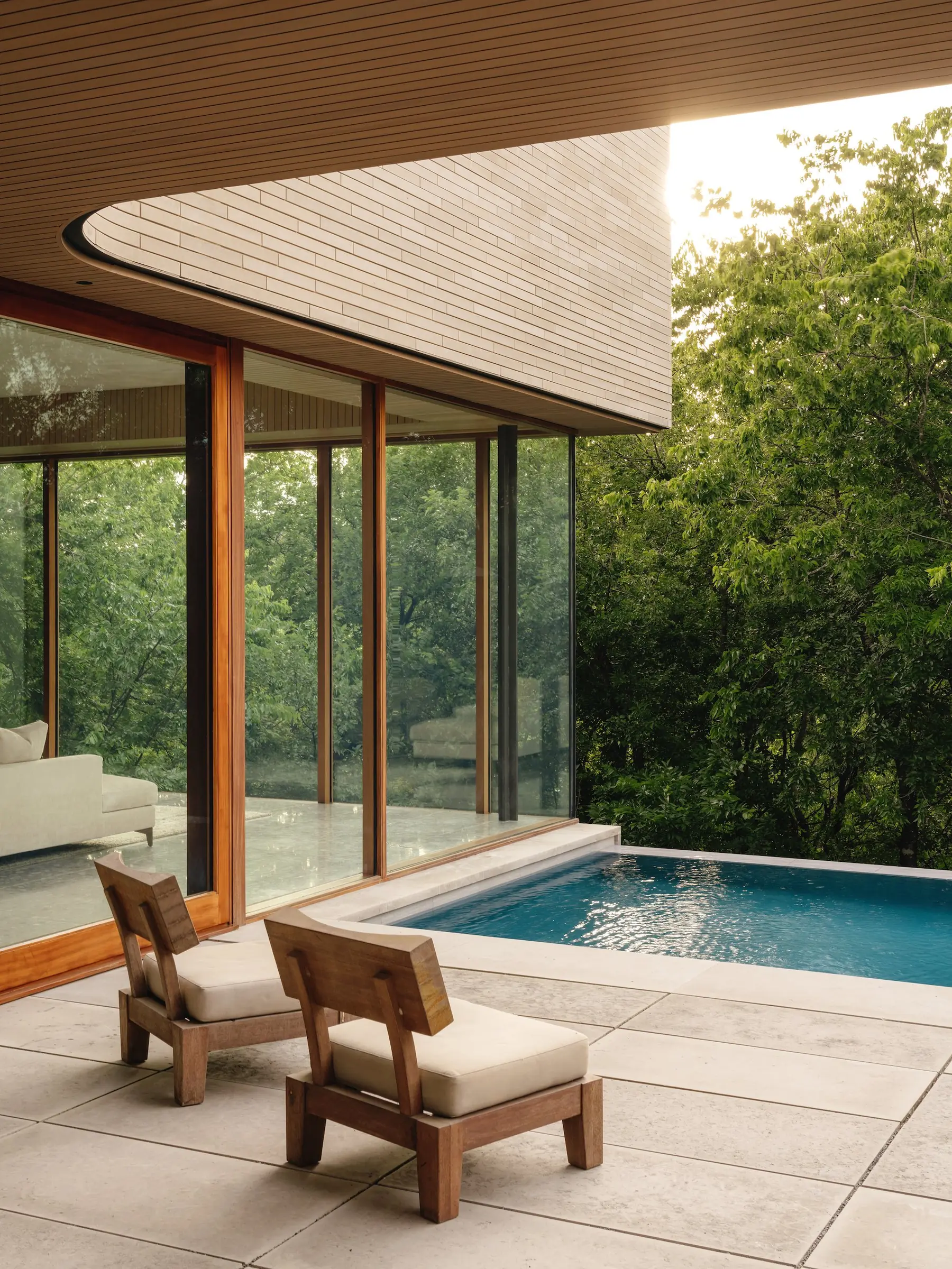Pool deck with chairs, Greenbelt Residence by Risinger Build, Austin, TX