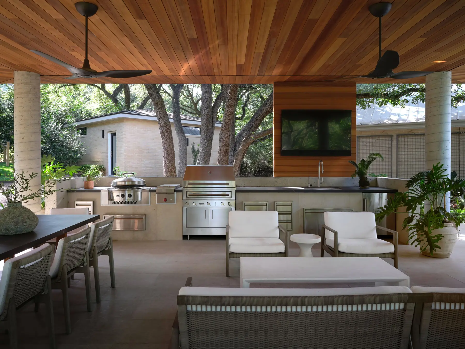 Covered outdoor kitchen at Lakeside, a Risinger Build remodel on Lake Austin