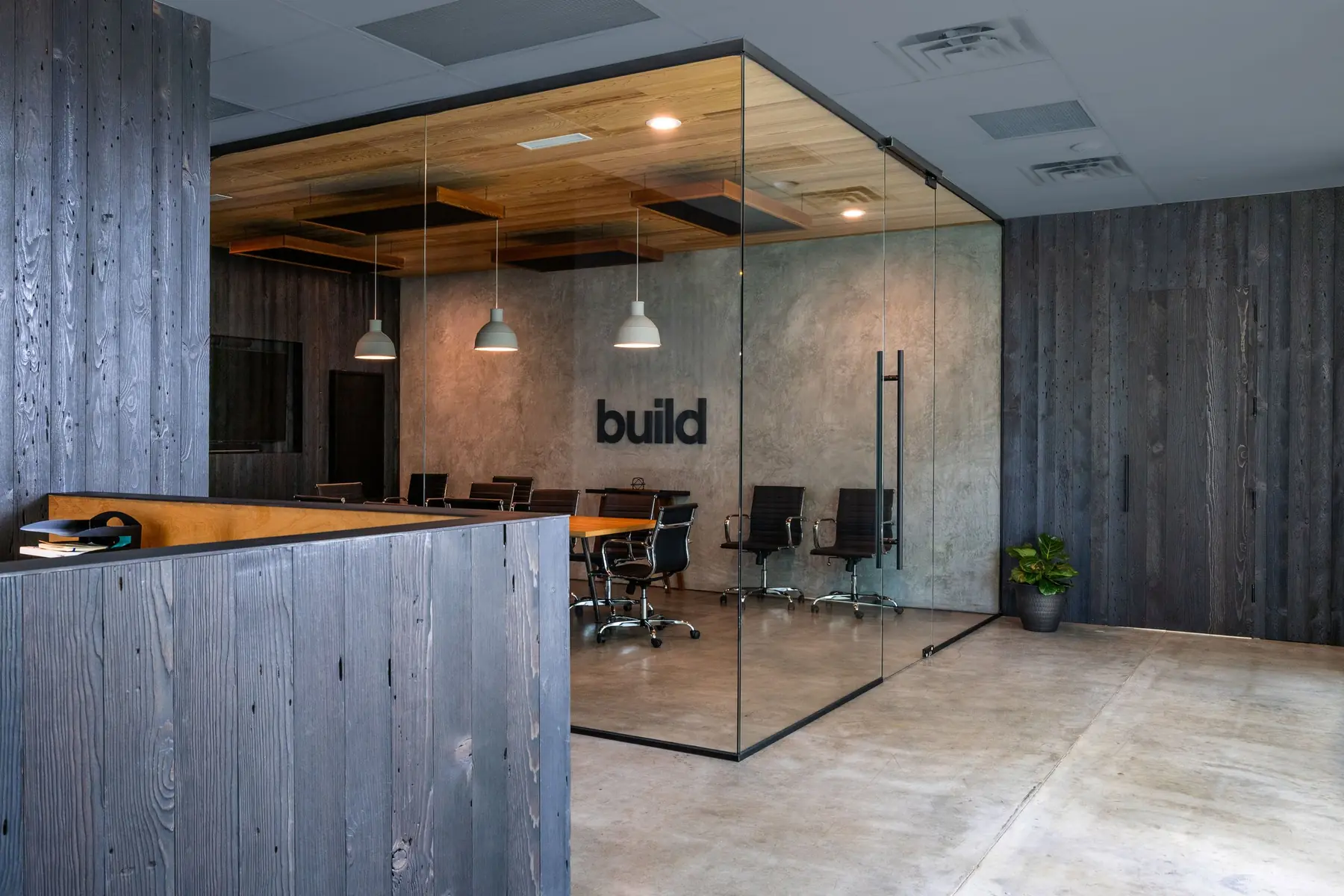 Entry and conference room at the Risinger Build office in North Austin