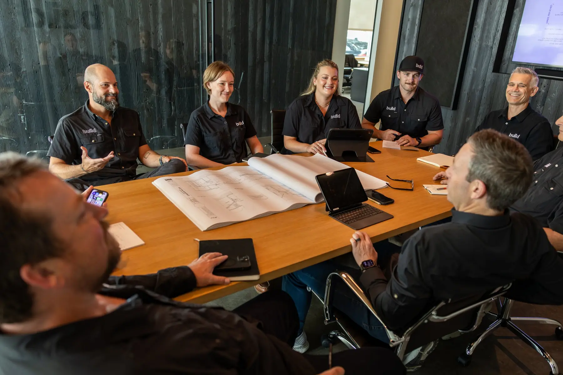 The Risinger Build team around the conference table at the Austin office